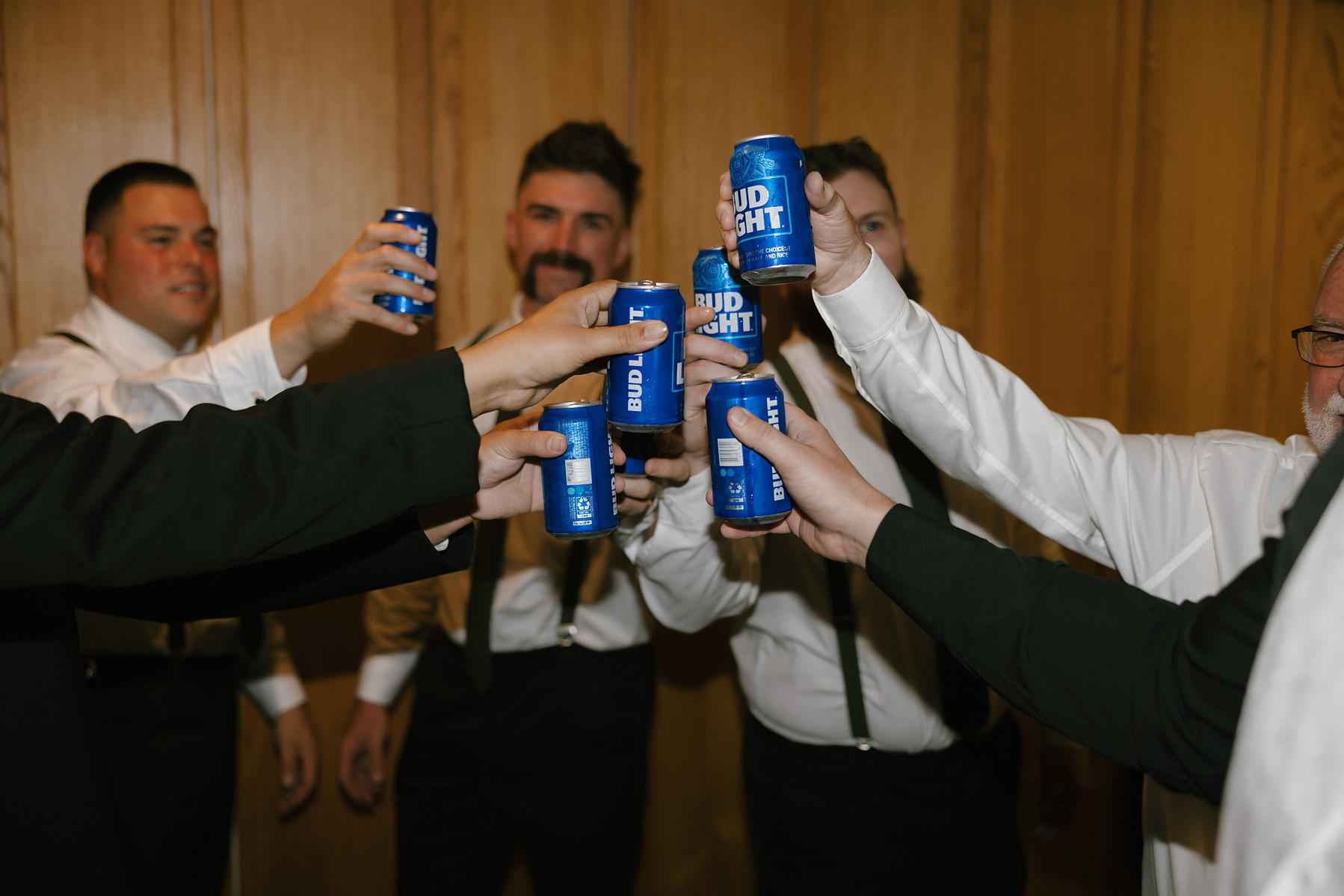 Groomsmen cheering for the groom. 