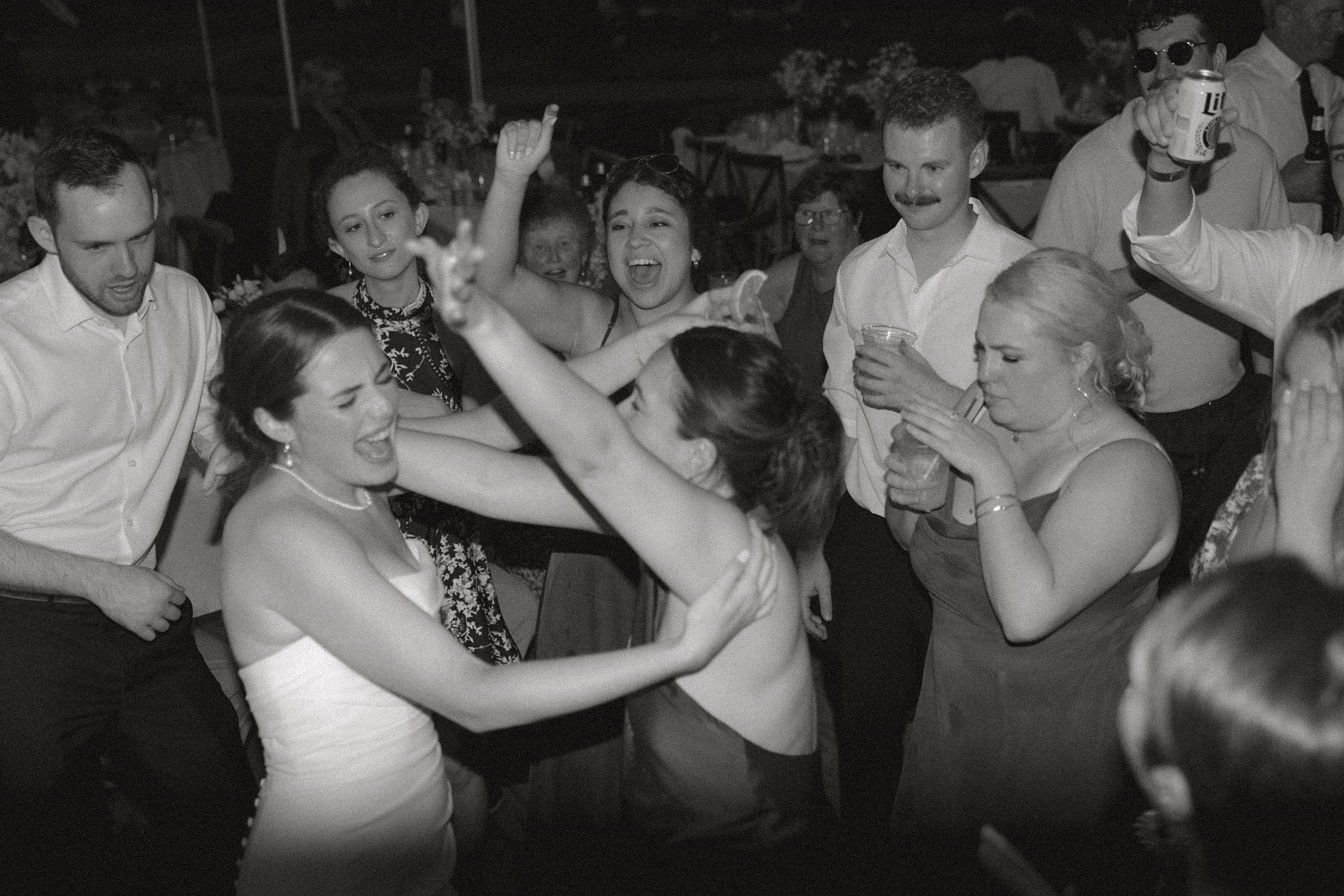 Bride dancing with her girls on the dance floor. 