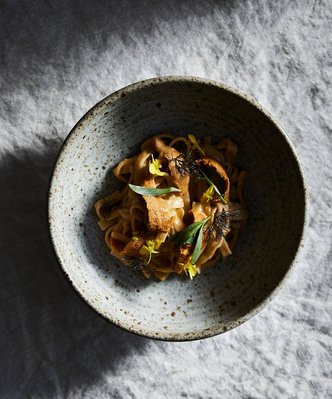 A bowl ofd sea urchin and noodles photographed in Tasmania by Sydney food photographer Nic Gossage
