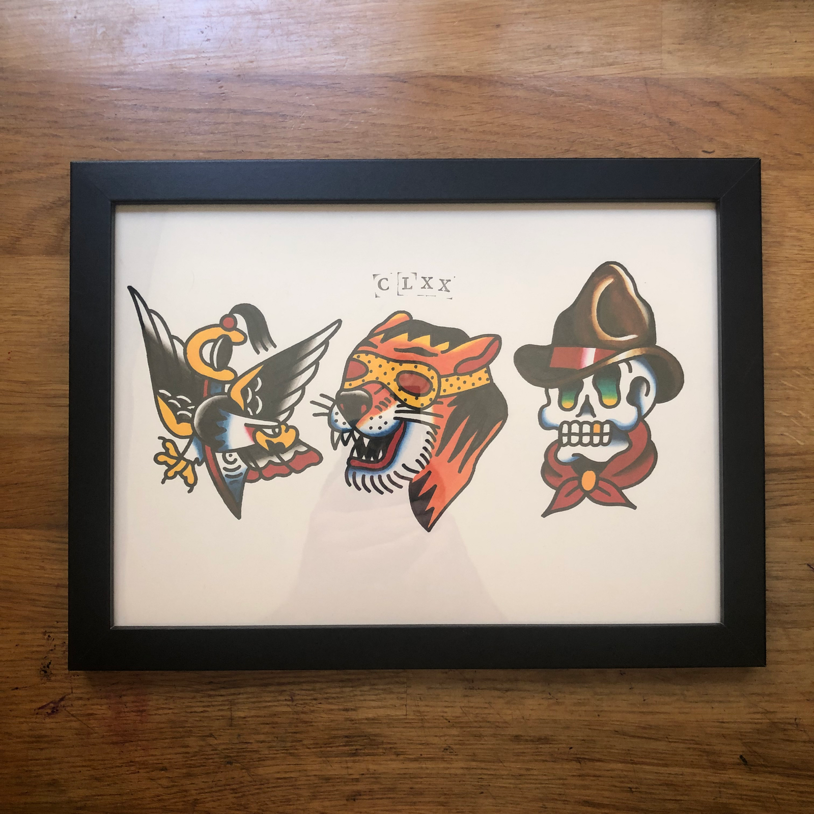 A hand painted traditional tattoo flash sheet. featuring reworks of classic tattoo designs by Bert Grimm and Tony Polito. painted by Chris Beaumont a tattoo artist at pretty strange tattoo in Hastings East Sussex