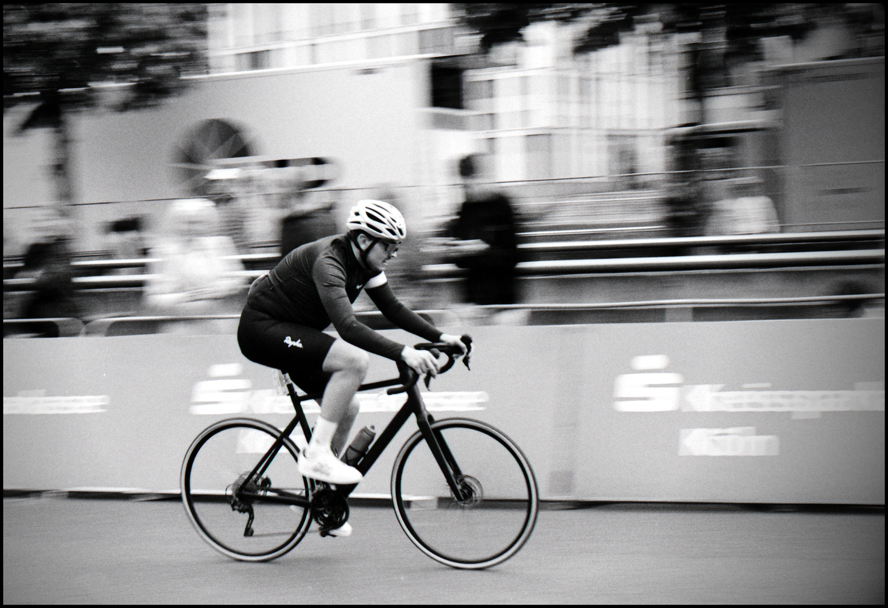 black and white analog photography of cycler at "Rund um Köln", a cyclinrace in cologne, Germany, photo by falko weidner.