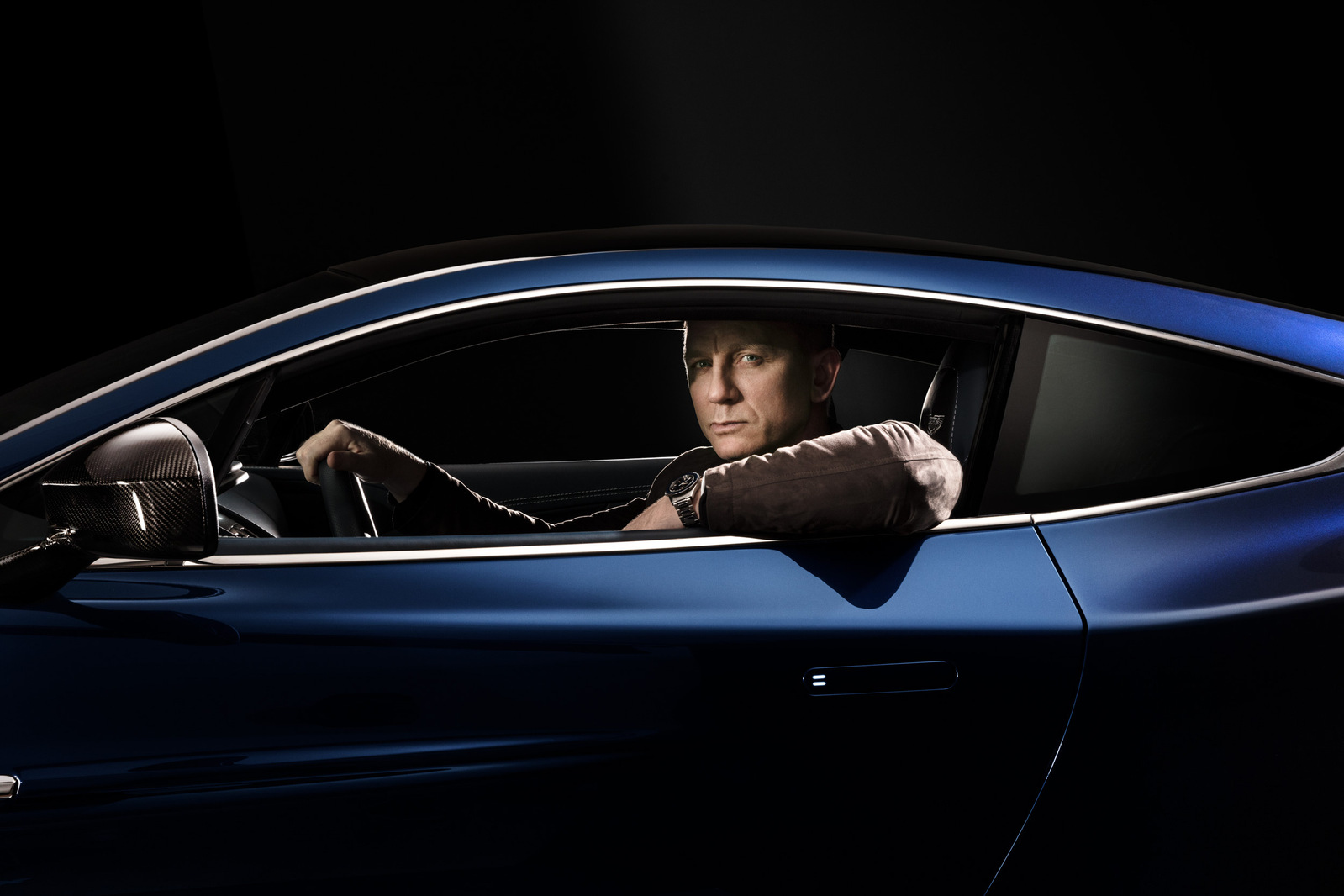 DANIEL GRAIG AND ASTON MARTIN