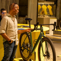 A man looking at a Colnago bicycle.