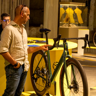 A man looking at a Colnago bicycle.