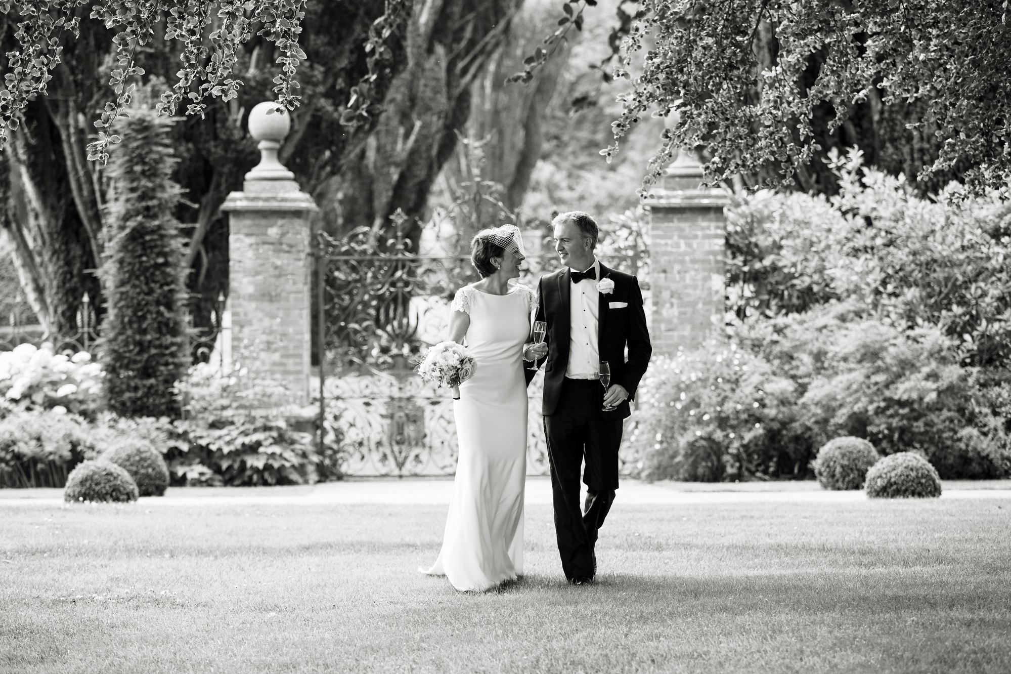 Natural, candid wedding photography.  Tinakilly House Hotel. Two photographers.  Wedding couple walking.  Black Tie.  Summer wedding.