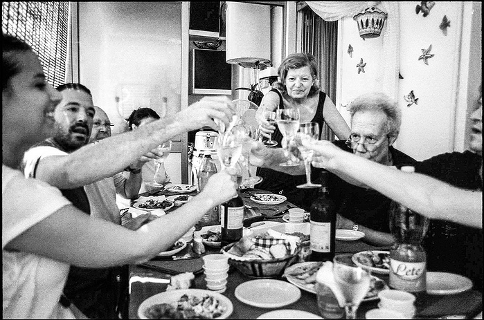 Italian family celebrating at a table in Palermo