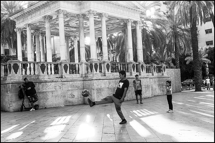 The immigrants are playing football in Palermo