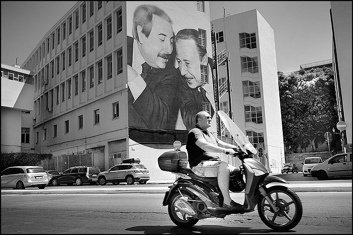 A scooter in Palermo with Giovani Falcon and Paolo Borcellino mural