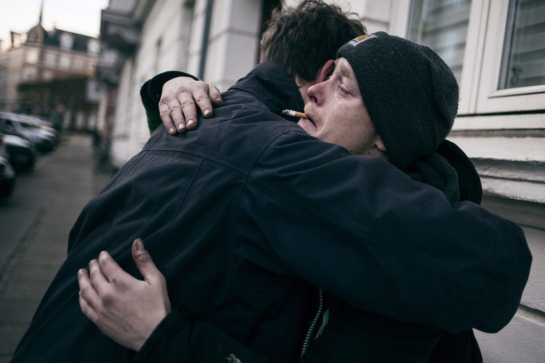 Martin cries as he meets a childhood friend. It has been three years since they last saw each other. Martin cries, as he don't think he will survive another three.