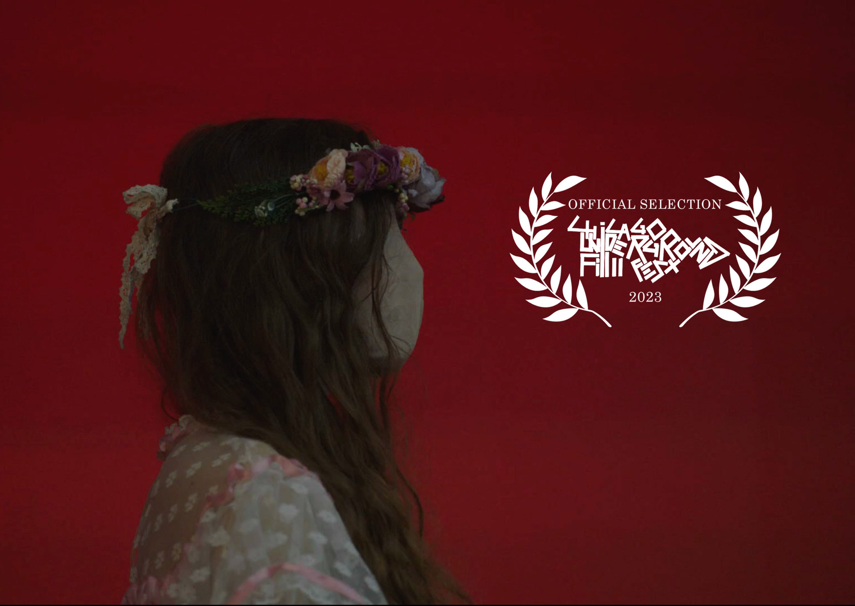 Strange masked girl against red wall background with Chicago Underground Film Festival laurels.