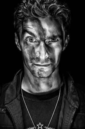Gritty black and white portrait photo of a man from the series Exteriors by Kelly Castro