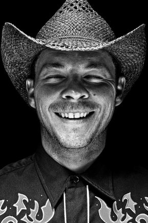 Gritty black and white portrait photo of a man from the series Exteriors by Kelly Castro