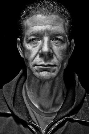 Gritty black and white portrait photo of a man from the series Exteriors by Kelly Castro