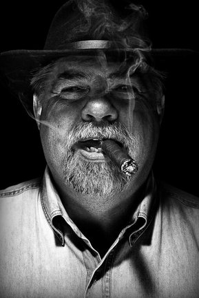 Gritty black and white portrait photo of a man from the series Exteriors by Kelly Castro