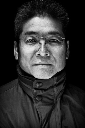 Gritty black and white portrait photo of a man from the series Exteriors by Kelly Castro