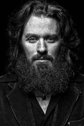 Gritty black and white portrait photo of SF artist Merkly from the series Exteriors by Kelly Castro