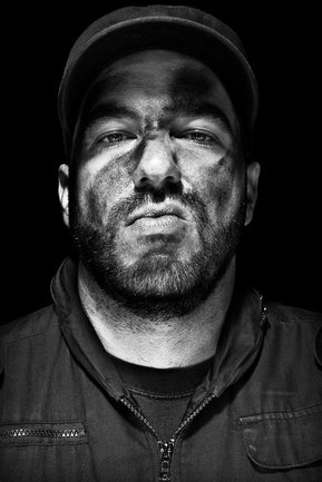 Gritty black and white portrait photo of a man from the series Exteriors by Kelly Castro