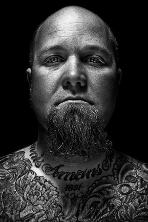 Gritty black and white portrait photo of a man from the series Exteriors by Kelly Castro
