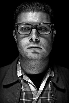 Gritty black and white portrait photo of a man from the series Exteriors by Kelly Castro