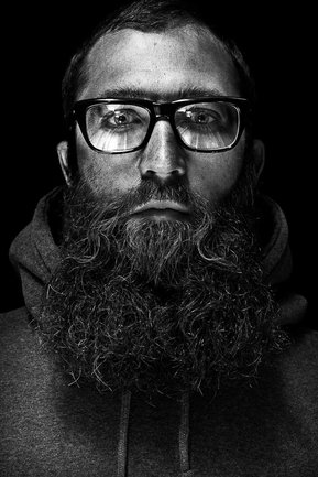 Gritty black and white portrait photo of a man from the series Exteriors by Kelly Castro