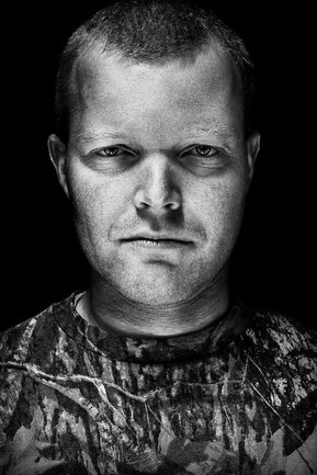 Gritty black and white portrait photo of a man from the series Exteriors by Kelly Castro