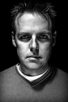 Gritty black and white portrait photo of John Nack from the series Exteriors by Kelly Castro