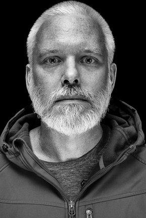 Gritty black and white portrait photo of a man from the series Exteriors by Kelly Castro