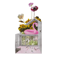 Analog collage of an interior of a house with a pink flamingo floatie in the second floor window and three stems of flowers coming out from the top.