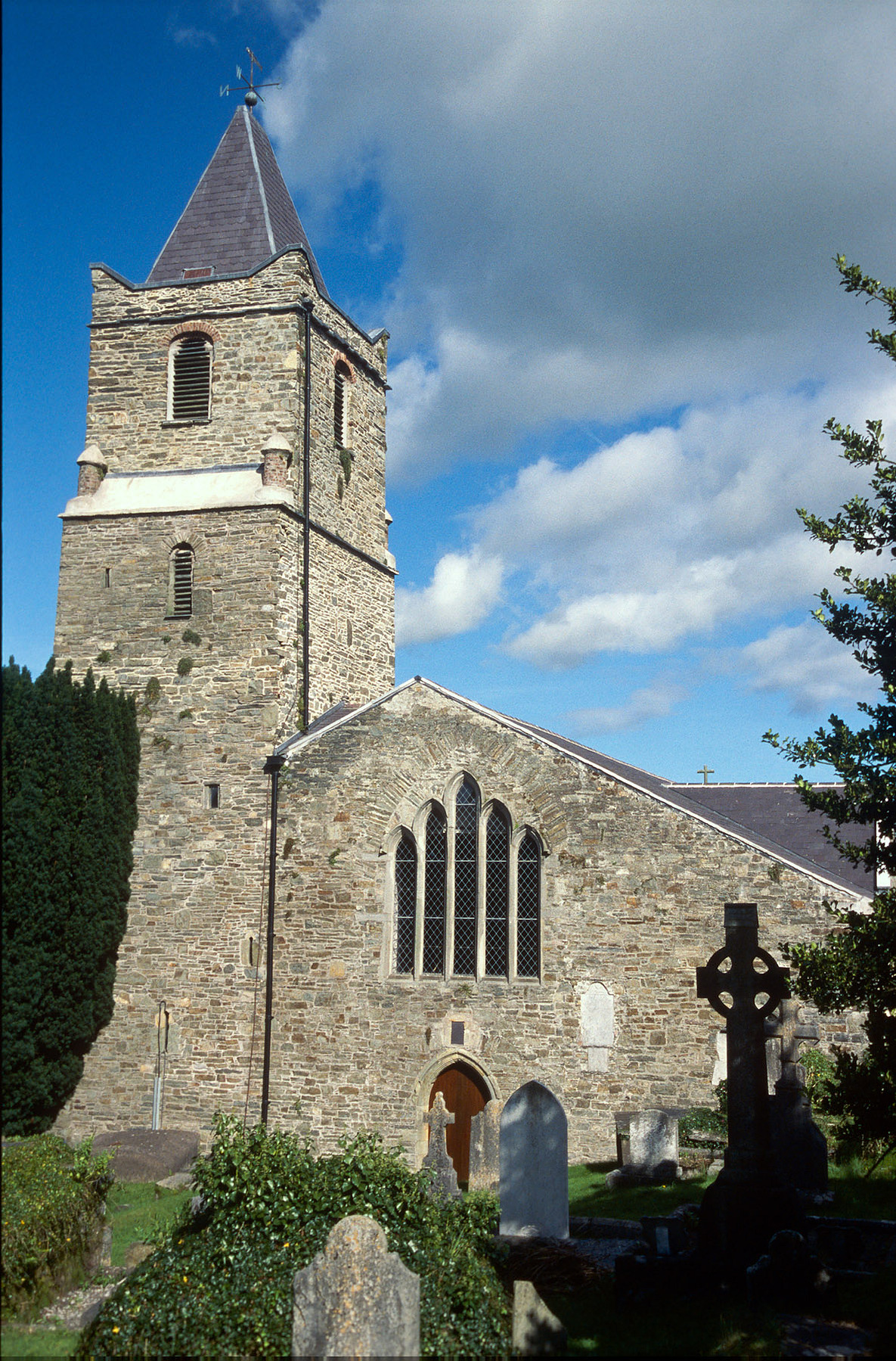 St Multose Church, Kinsale—photographed on Kodak Ektachrome 35mm slide film many years ago. This medieval church and its graveyard, set in the heart of the town, have long held the stories of those lost to the sea, including victims of the Lusitania.