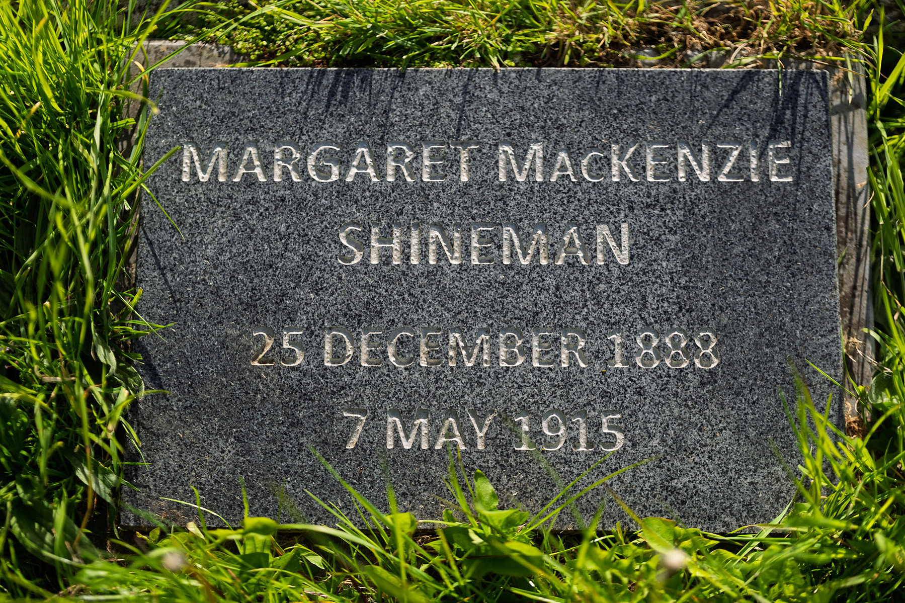 The new marble gravestone installed in 2016, naming Margaret MacKenzie Shineman—a once-unknown victim of the Lusitania, finally restored to memory.