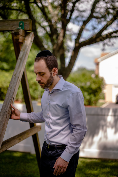 HIGHLAND PARK, NEW JERSEY- JULY 29, 2021: Amit Friedlander, 37, poses for a portrait at his home. Friedlander was a senior at Stuyvesant High School when 9/11 happened. He and his classmates were evacuated from the school but returned to their normal camp
