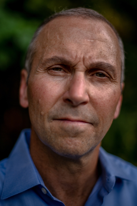 OAKLAND, NEW JERSEY- JULY 7, 2021: John Mormando, 54, poses for a portrait in his backyard. Mormando was diagnosed with 9/11 related male breast cancer in March of 2018. Mr. Mormando is a commodities broker and was working on the floor of the New York Mer