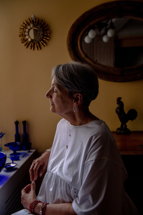 NEW YORK, NEW YORK- JUNE 29, 2021: Barbara Mohan poses for a portrait in her apartment. Mohan had been wheelchair bound in her home for months while she battled Lymphoma, a cancer she contracted from working near the debris pile of the fallen twin towers.