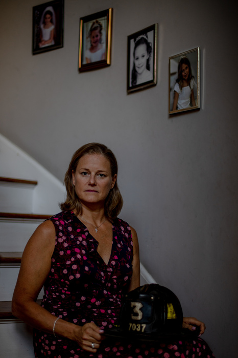 NEW ROCHELLE, NEW YORK- AUGUST 23, 2021: Carrie Foley, 47, poses for a portrait at her home. Carrie's husband, Daniel Foley, died on February 22nd of 2020 after a year long battle with pancreatic cancer. Daniel was a firefighter with Rescue 3 in the Bronx