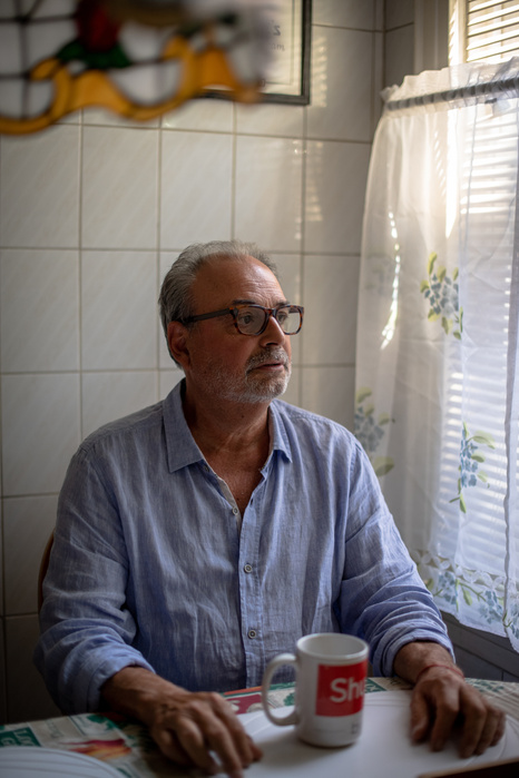 MASPETH, NEW YORK- JULY 28, 2021: Martin Preston, 68, poses for a portrait at his home. Preston worked for five different NYC mayors before retiring. On 9-11 and in the weeks that followed he worked as the assistant commissioner for Rudy Giuliani and was