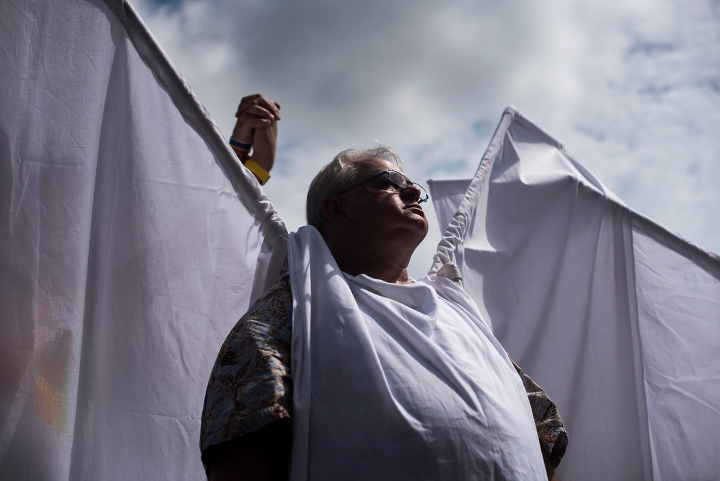 ORLANDO, FLORIDA- JUNE 18, 2016: Michael Wanzie dressed as an angel to help block the presence of the Westboro Baptist Church at the funeral for Juan Ramon Guerrero and Christopher "Drew" Leinonen on Saturday outside of Cathedral of St. Luke following the