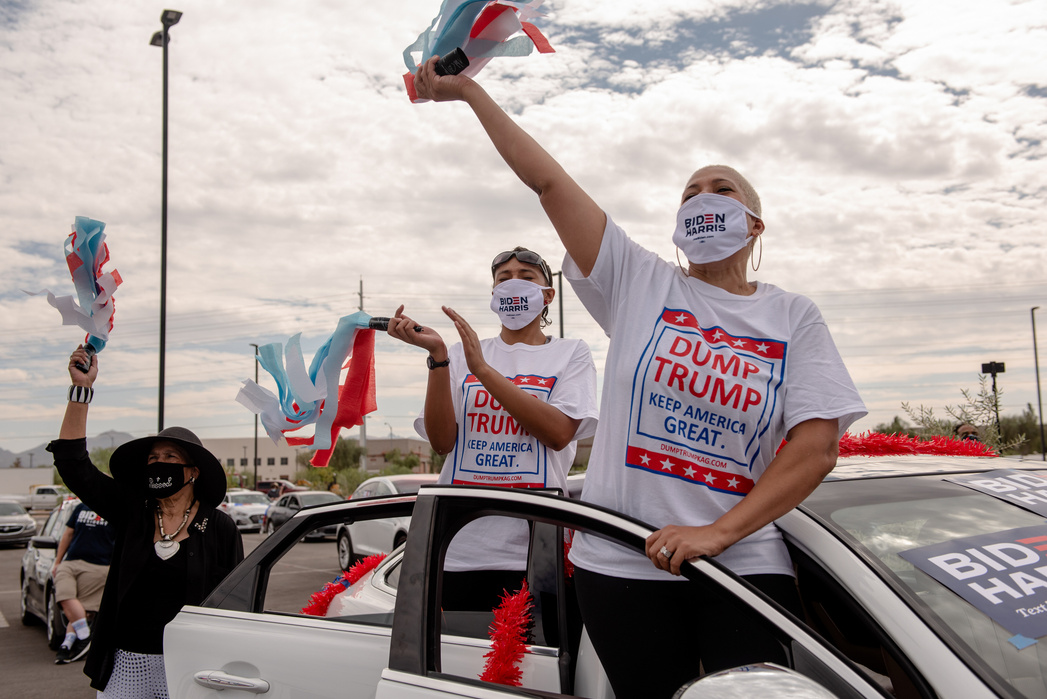 LAS VEGAS, NEVADA- OCTOBER 9, 2020: From left, Ruth Brooks, London Brooks, 18, and Crystal Brooks wait to see Former Vice President and Democratic Presidential Nominee Joe Biden speak at Southeast Career Technical Academy to a drive in crowd on Friday.