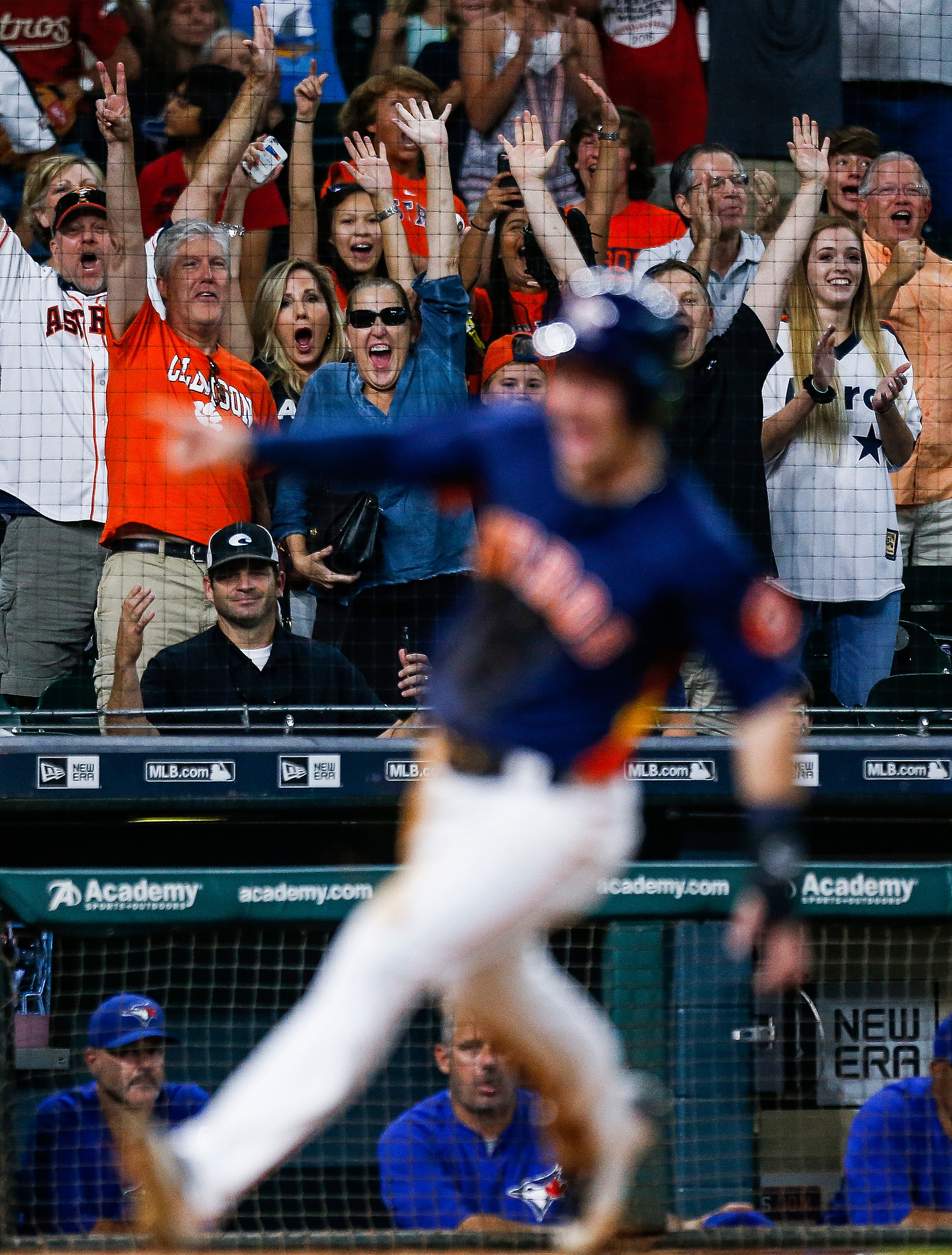 The crowd reacts as Houston Astros third baseman Alex Bregman (2) runs home to score the wining run off a hit by catcher Juan Centeno (30) during the ninth inning. The Houston Astros scored four runs in the ninth to beat the Toronto Blue Jays 7-6 Sunday,