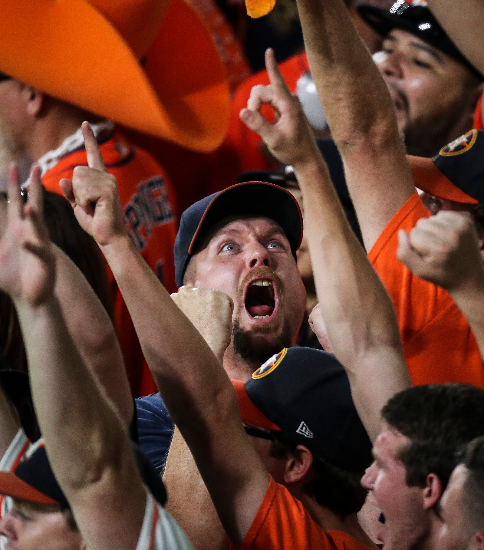 Fans celebrate after an out called against the Houston Astros was reversed as the Houston Astros take on the Boston Red Sox during the fourth inning of the first game of the American League Divisional Series at Minute Maid Park Thursday, Oct. 5, 2017 in H