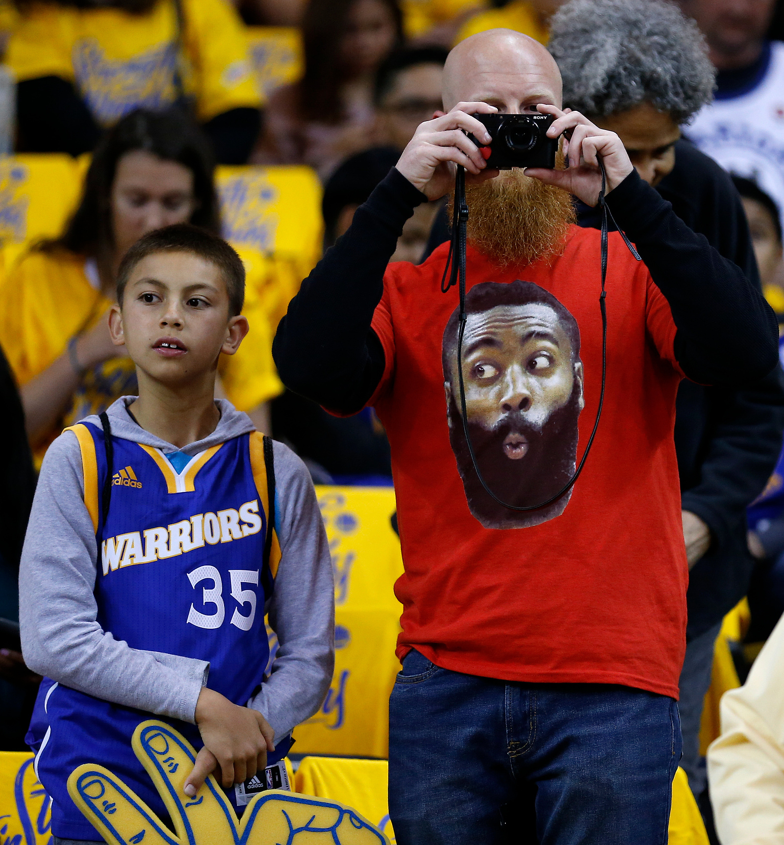 Golden State Warriors and Houston Rockets fans watch warm ups before Game 4 of the Western Conference Finals at Oracle Arena Tuesday, May 22, 2018 in Oakland.