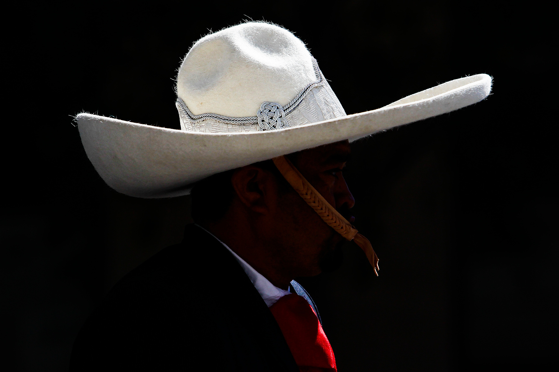 A horseback rider gallops through downtown Houston for the Rodeo Parade Saturday, Feb. 27, 2016. ( Michael Ciaglo / Houston Chronicle )