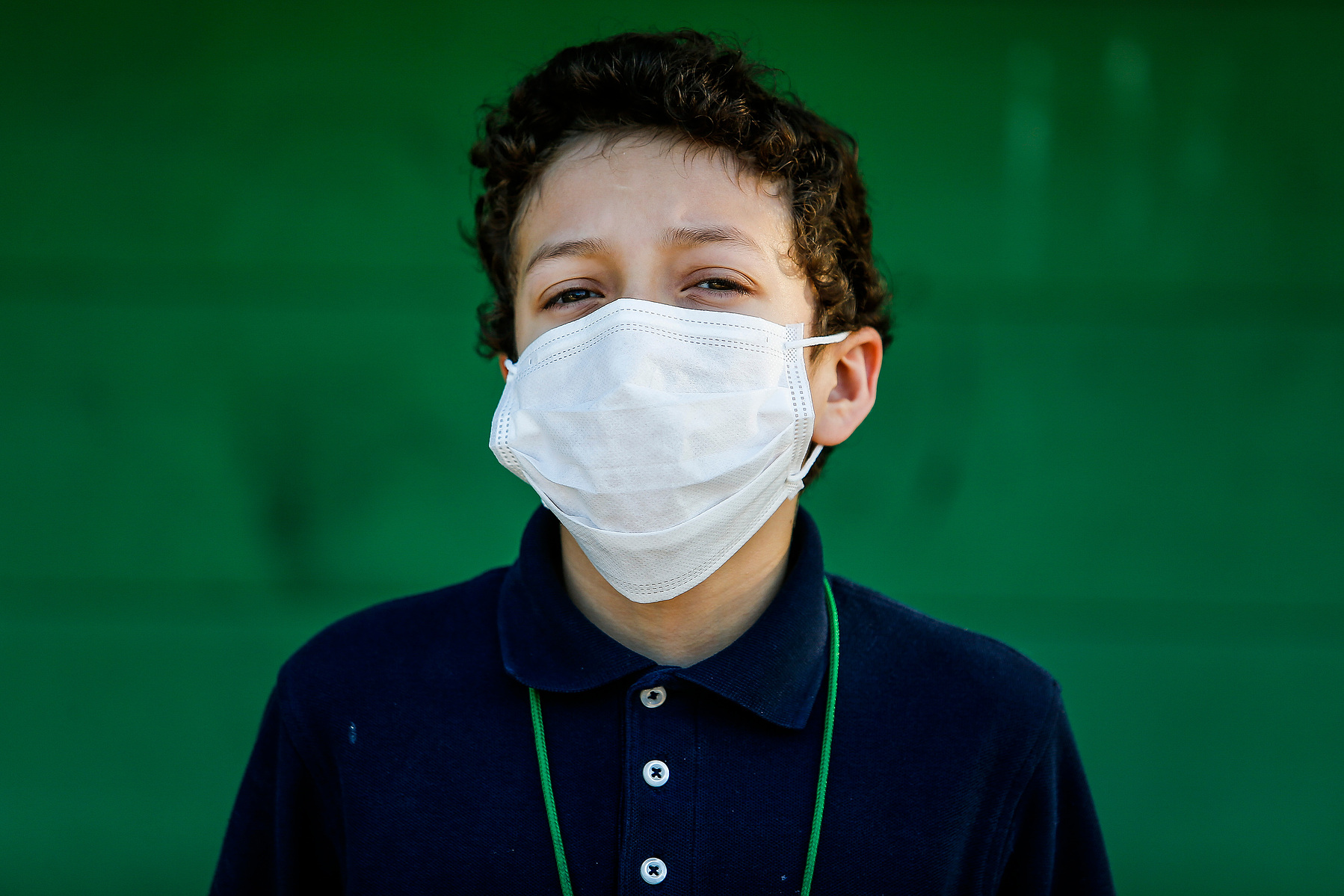 David Melendez, 12, wears a mask as he prepares to go to school Friday, May 6, 2016 in Houston. Melendez put on the mask when he started to worry about what he may be breathing in from the four-alarm fire next door at Custom Packaging and Filling Company