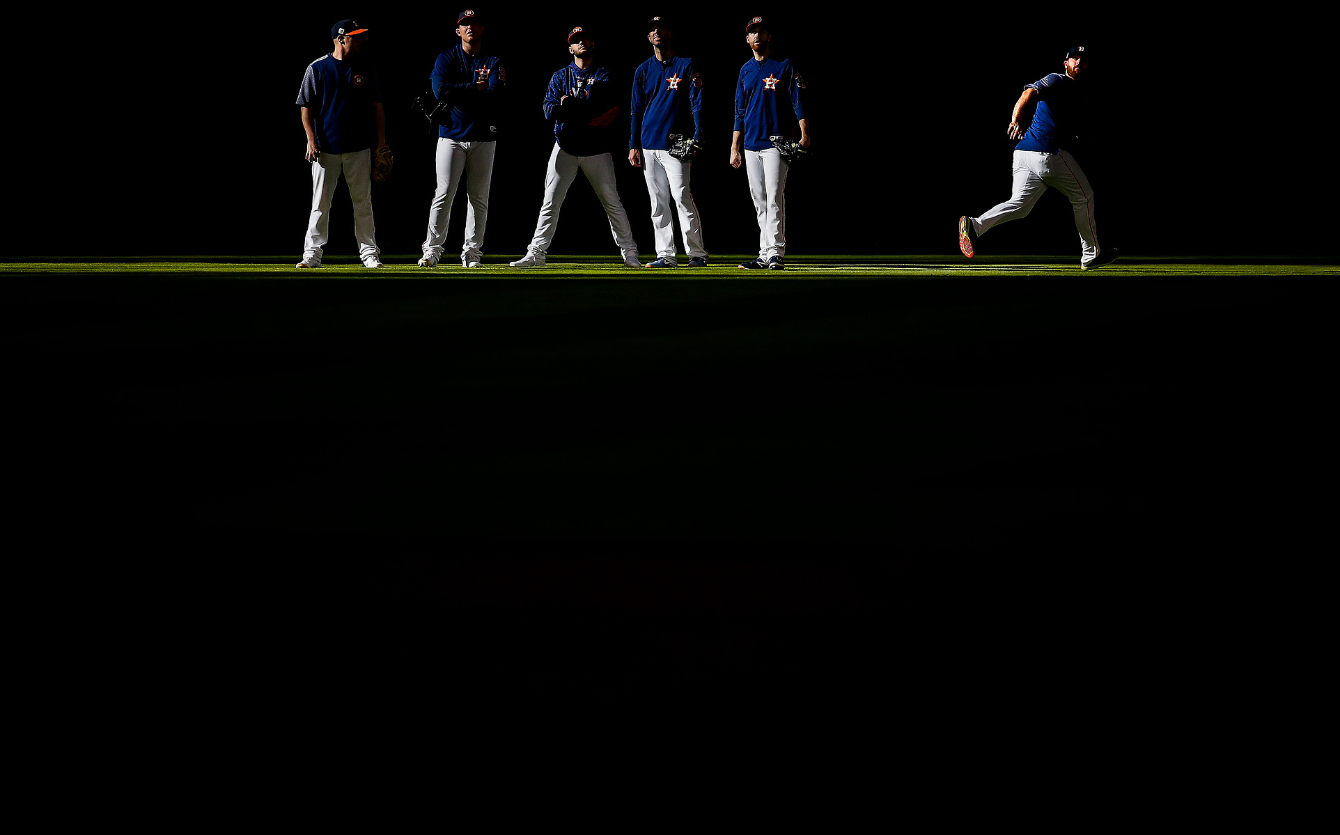 Houston Astros players catch balls during batting practice before the Houston Astros take on the Los Angeles Dodgers in Game 4 of the World Series at Minute Maid Park Saturday, Oct. 28, 2017 in Houston.