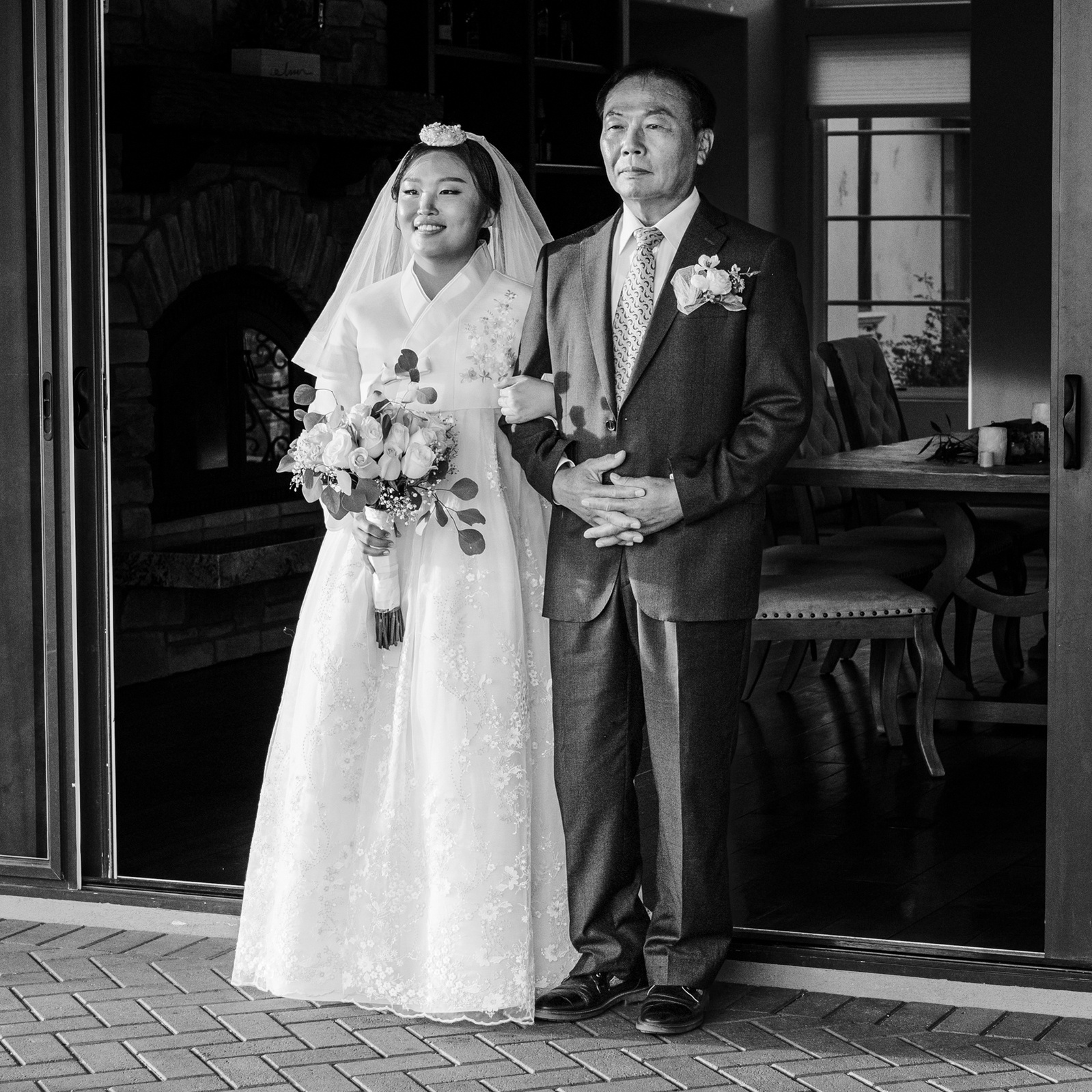 black and white image of the bride with her father 
