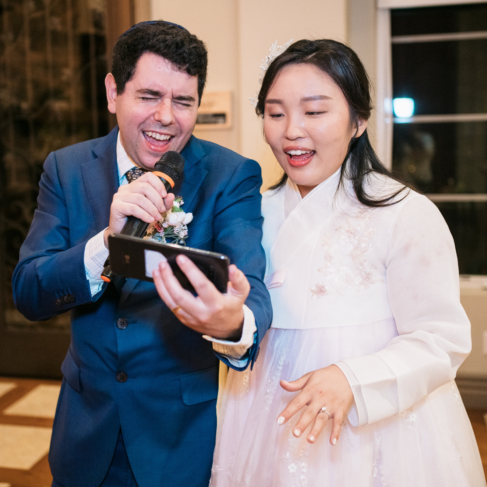 groom and bride sing karaoke