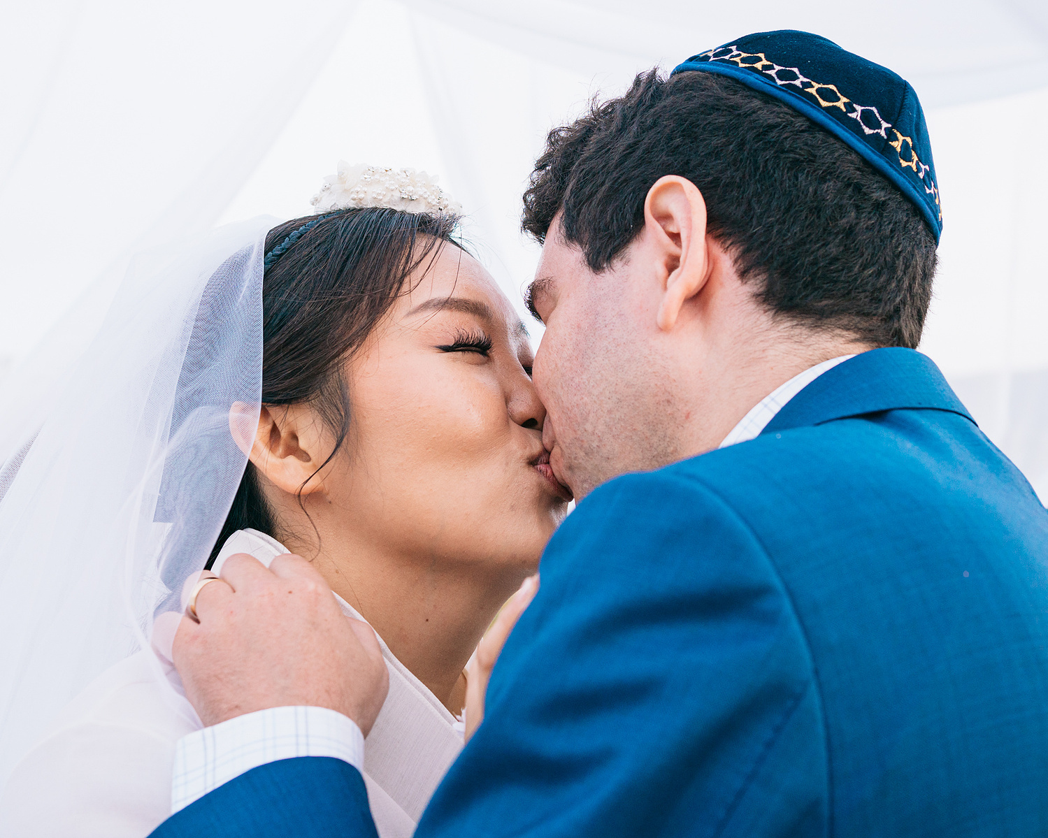 "you may kiss the bride" or something like that bride and groom kiss