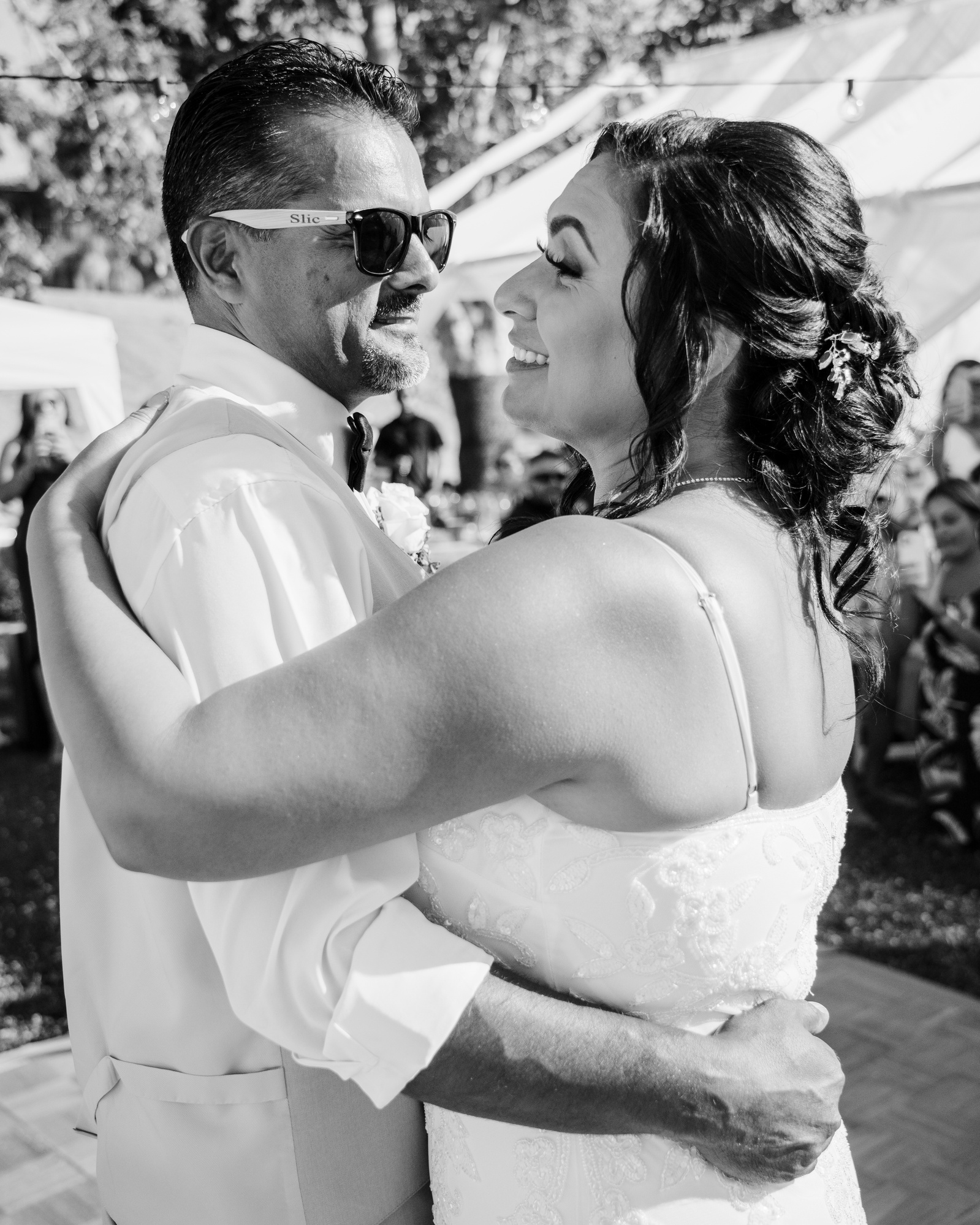 black white first dance as husband and wife happy bride adoring groom