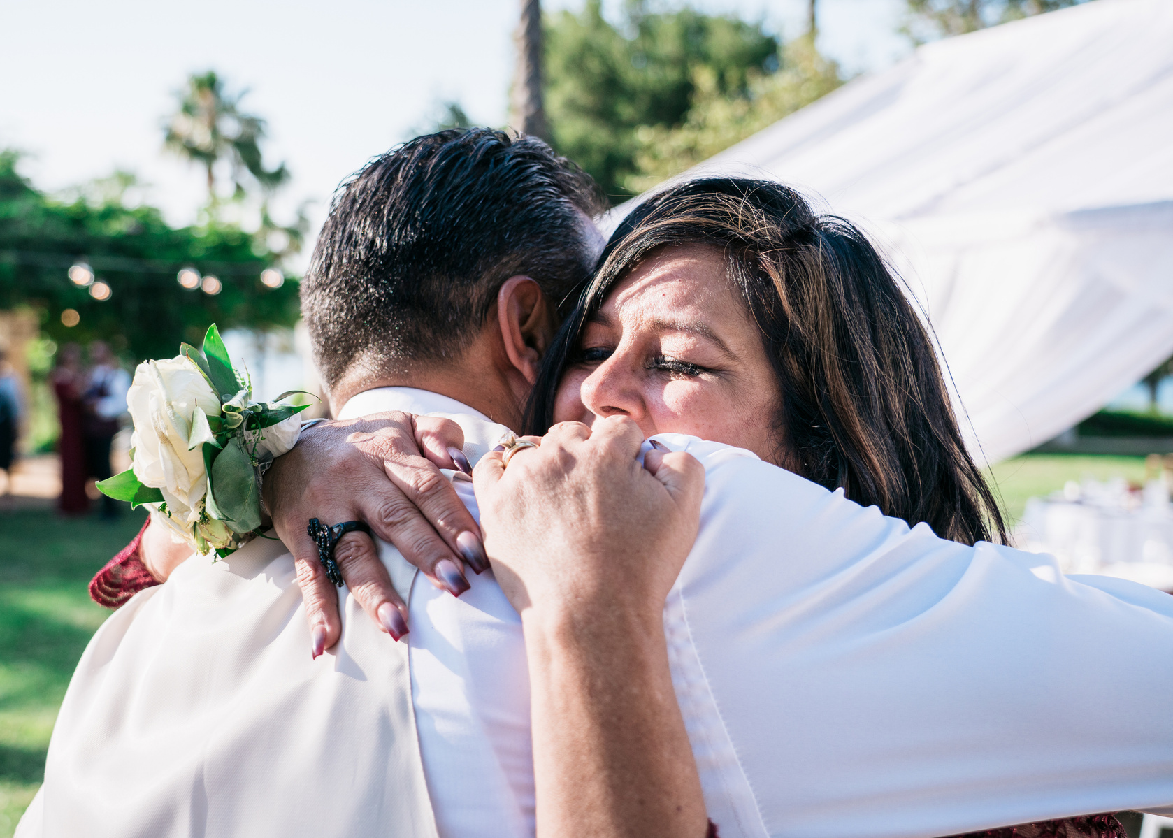 mother/son dance stepmother of the groom embraces her stepson