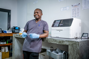 Guinean chemist working in the laboratory at the Sacré Coeur medical clinic in Guinea, West Africa.