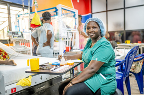 Guinean nurse providing emergency care in the ER at the Sacré Coeur medical clinic in Guinea, West Africa.